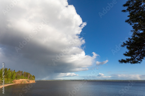 Summer landscape with a river  blue sky and cloud. Before a thunderstorm with rain