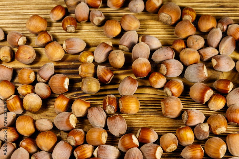 Heap of hazelnuts on a wooden table Heap of hazelnuts on a wooden table
