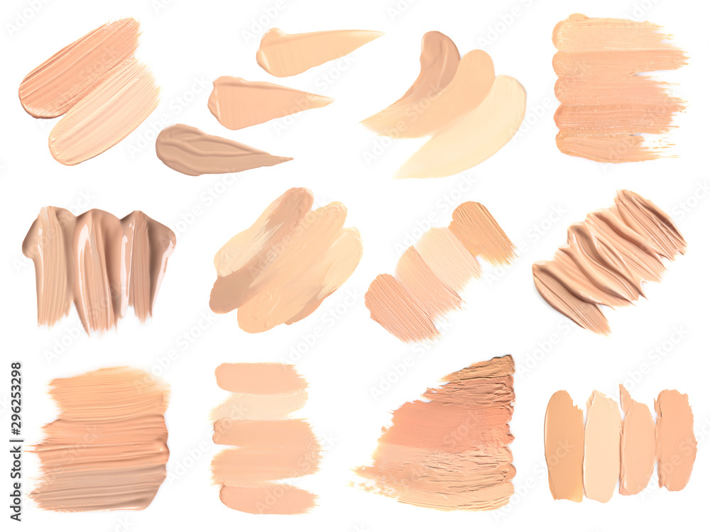 Set of different foundation shades on white background, top view Set of different foundation shades on white background, top view