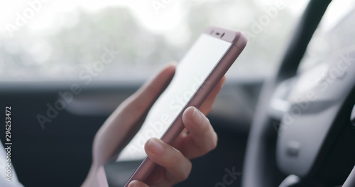 woman use smartphone in car