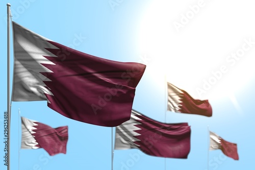 Wallpaper Mural nice holiday flag 3d illustration. - 5 flags of Qatar are waving against blue sky picture with bokeh Torontodigital.ca