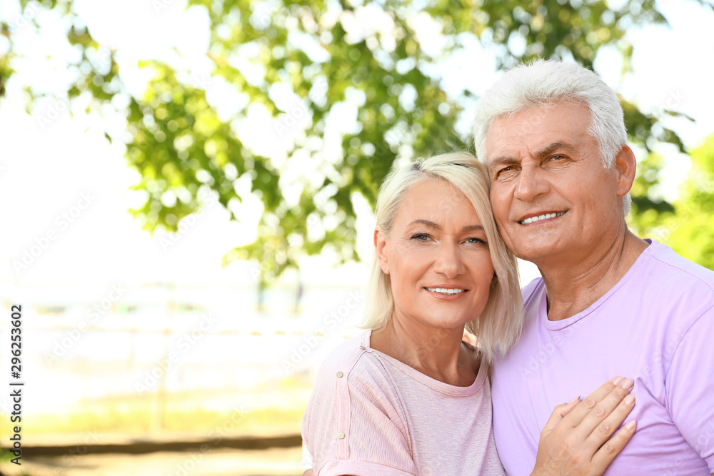 Portrait of affectionate senior couple on city street. Space for text Portrait of affectionate senior couple on city street. Space for text