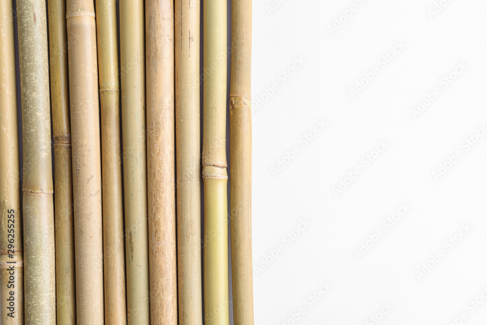 Dry bamboo sticks on white background, top view Dry bamboo sticks on white background, top view