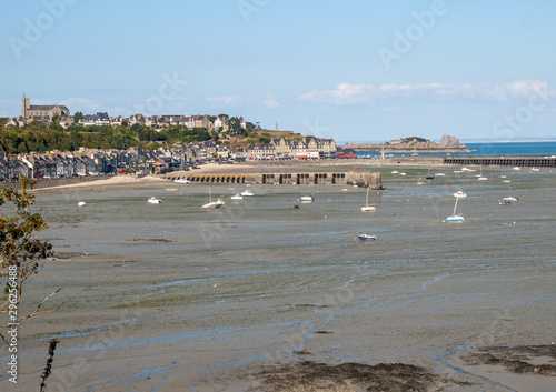 Boats on dry land at the beach at low tide in Cancale famous oysters production town, Brittany, France, © wjarek
