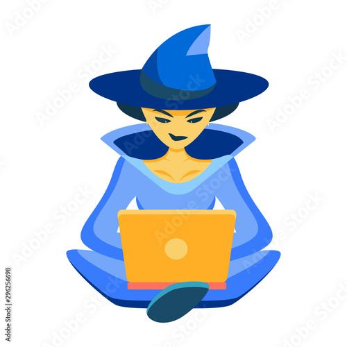 IT witch. The sorceress works on the laptop in a suit of the sorceress. Congratulations on Halloween for co-writers, programmers, writers. Concentratedly programs or writes a text even on a holiday