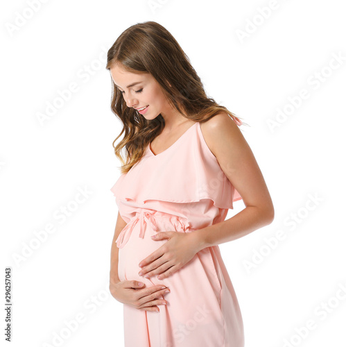 Young pregnant woman on whi...