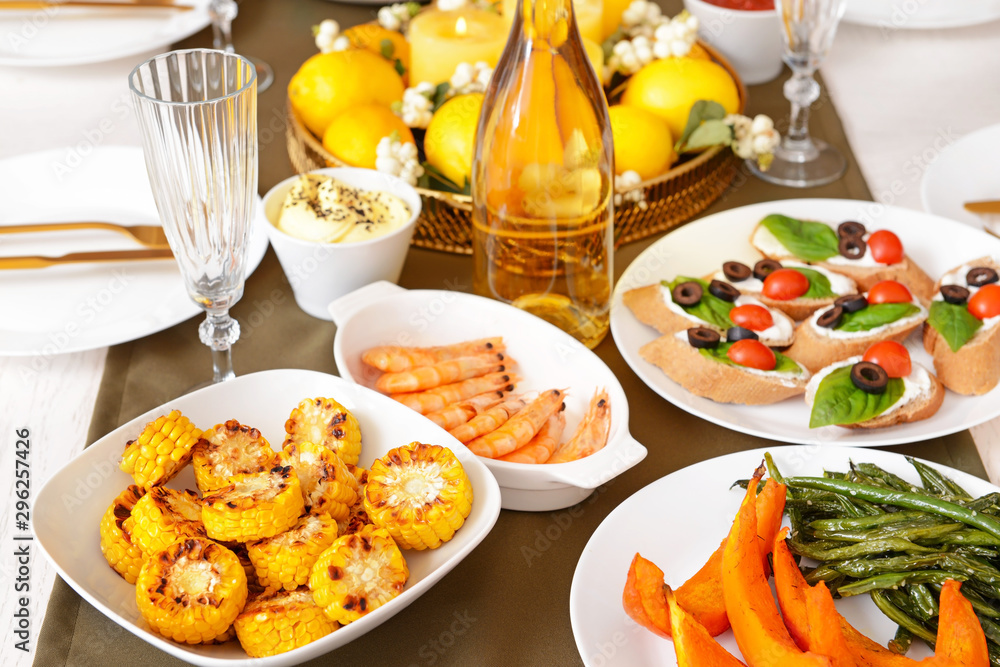 Many dishes served on table for big family dinner Many dishes served on table for big family dinner
