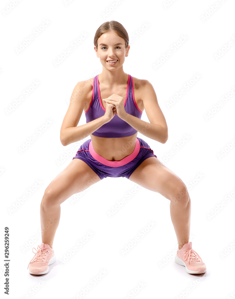 Sporty young woman training against white background Sporty young woman training against white background