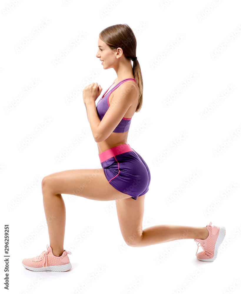 Sporty young woman training against white background Sporty young woman training against white background