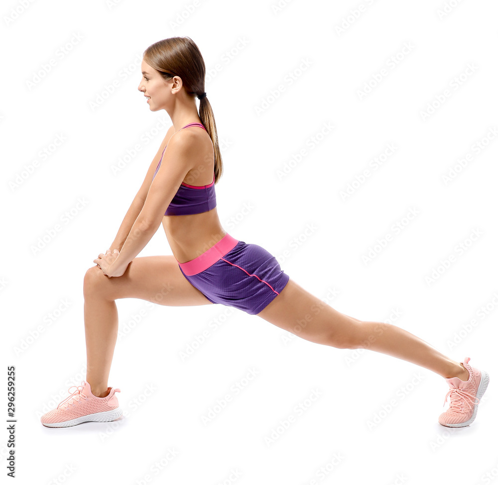 Sporty young woman training against white background Sporty young woman training against white background