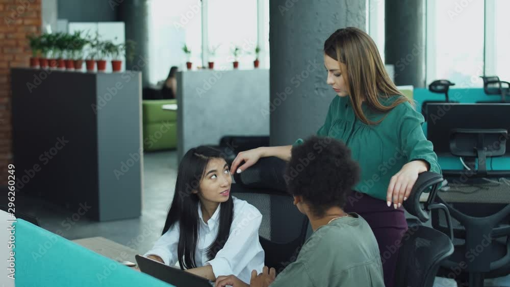 International teamwork in modern office space, female managers communicate in the workplace International teamwork in modern office space, female managers communicate in the workplace