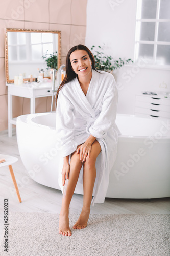 Beautiful young woman apply...