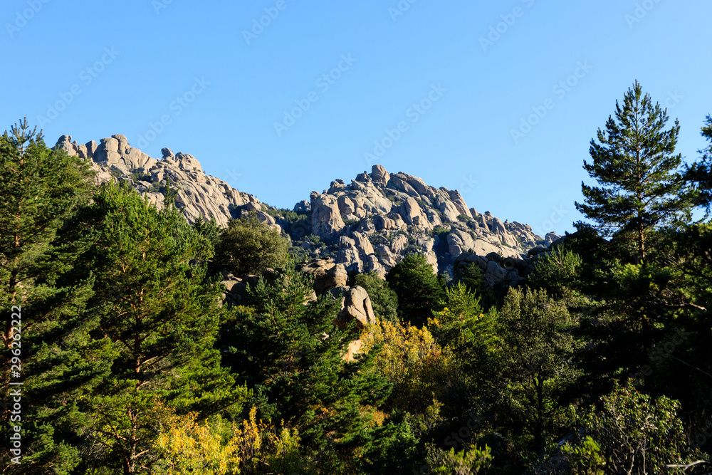 Views of the Pedriza mountain, in Madrid, Spain, in the early hours of the morning when the sun rises between the granite rocks
