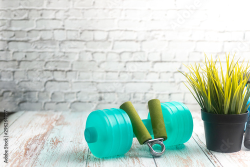 Fitness Equipment on Wooden Background. Shallow depth of field