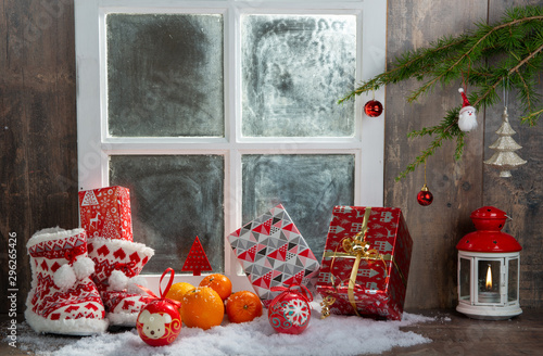 christmas concept with oranges with snow, wooden window background