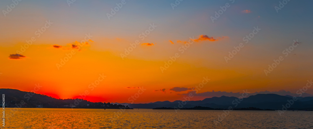 Natural Sunrise Sundown Over Sea Horizon island silhouette