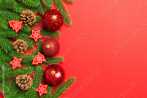 Set of festive balls  fir tree and Christmas decorations on colorful background. Top view of New Year ornament concept with copy space