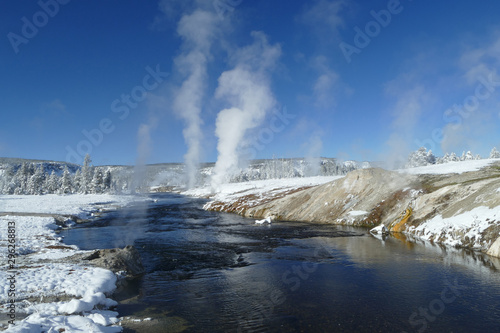 River with geysers during winter in Yellowstone National Park, United States