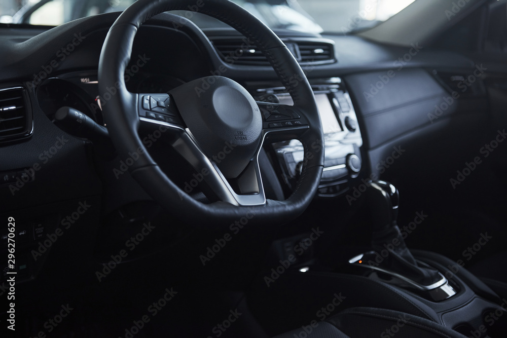 Steering wheel. Front part of the new expensive modern car that captured inside