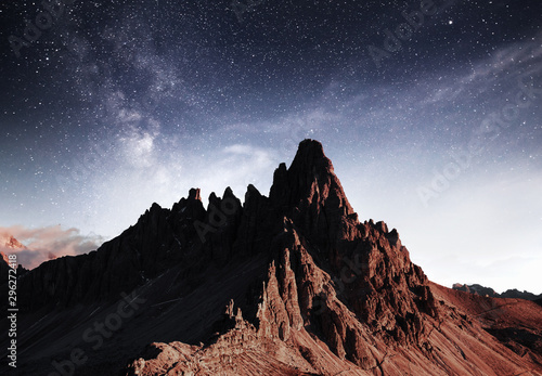 Clouds far away. Photo of the big dolomite mountains. Majestic view. Milky way is in the sky © standret