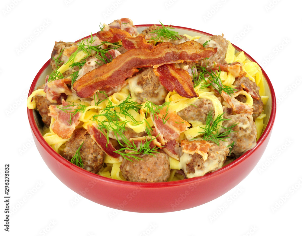 Meatball and smoky bacon pasta meal isolated on a white background Meatball and smoky bacon pasta meal isolated on a white background