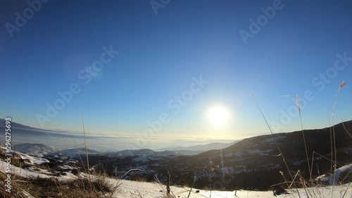 Mountain peaks in winter with sunset landscape photo