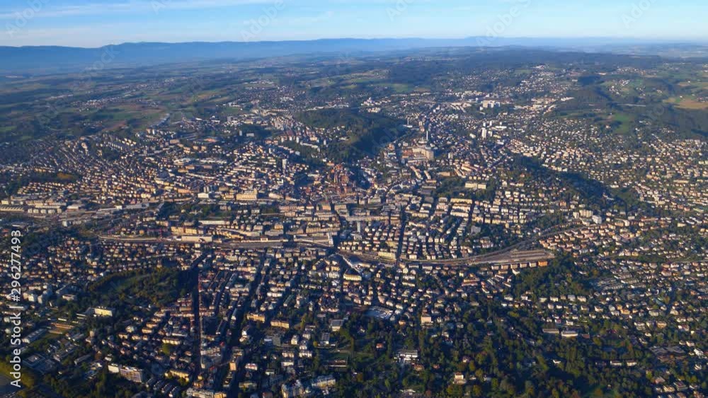 High altitude aerial shot over Lausanne city, panning right towards Lutry and Lavaux vineyard. Lausanne, Switzerland High altitude aerial shot over Lausanne city, panning right towards Lutry and Lavaux vineyard. Lausanne, Switzerland