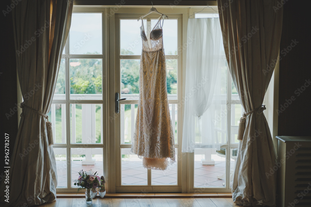 wedding dress at the window