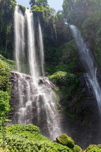 Sekumpul Waterfalls surrounded by tropical forest in Bali  Indonesia.