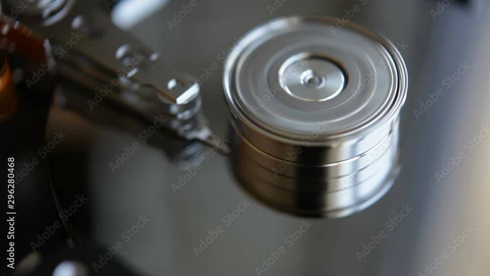 Computer HDD hard drive at work. Hard disk rotation. Macro shooting. Computer HDD hard drive at work. Hard disk rotation. Macro shooting.