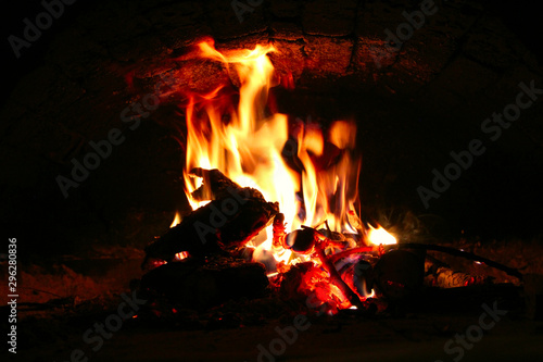 Fire wood brighly burning in furnace. Fire and flames