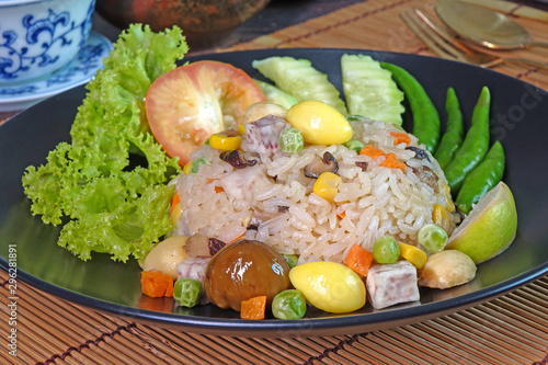 Eight immortals fried rice (or Baxian rice), Fragrance fried rice with chestnut, ginkgo biloba, mushroom, lotus seeds, sweet pea, taro, carrot and corns. Vegetarian food for vegetarian festival. photo