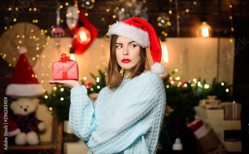 Lady adorable cute face celebrate christmas at home. Girl stylish makeup red lips making christmas wish. Cozy christmas atmosphere. Believe in miracle. Woman santa claus hat on christmas eve