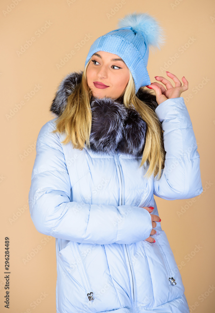 Be happy. woman in padded warm coat. happy winter holidays. Xmas coming. flu and cold. seasonal fashion. girl in beanie hat. faux fur fashion. beauty in winter clothing. cold season shopping Be happy. woman in padded warm coat. happy winter holidays. Xmas coming. flu and cold. seasonal fashion. girl in beanie hat. faux fur fashion. beauty in winter clothing. cold season shopping