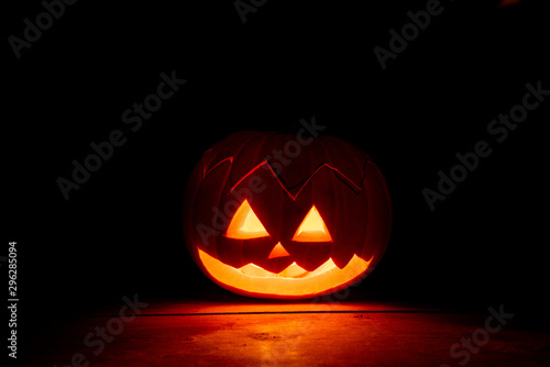 Halloween pumpkin lit up at night