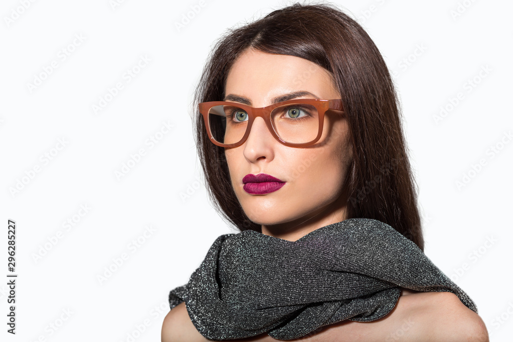 Portrait of beauty model with natural make up wearing eyeglasses and scarf Portrait of beauty model with natural make up wearing eyeglasses and scarf