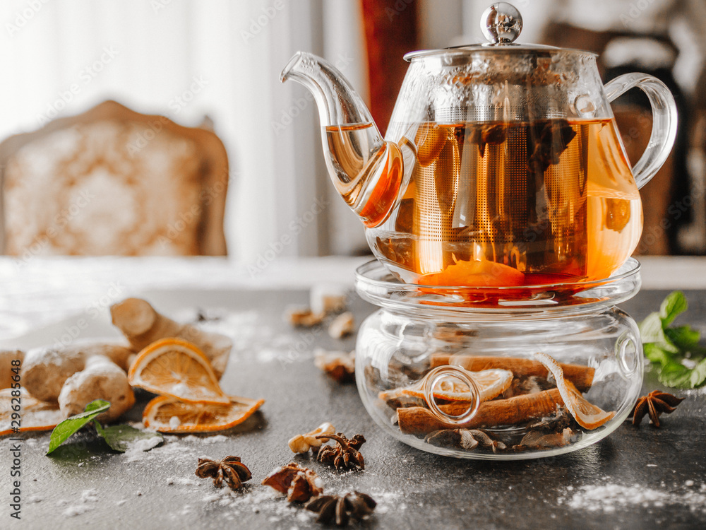 Herbal tea in a beautiful glass teapot with spices Herbal tea in a beautiful glass teapot with spices