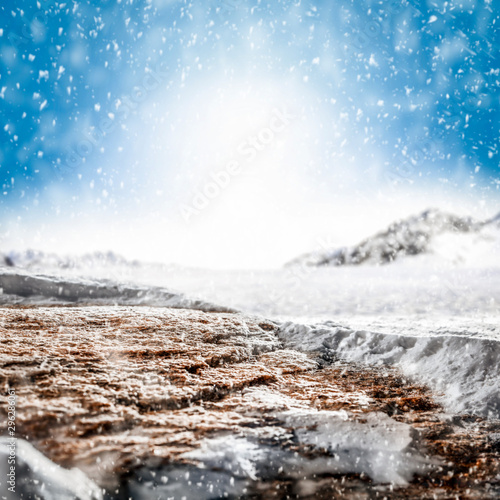 Blurred snowy winter background with shimmering snow. © magdal3na