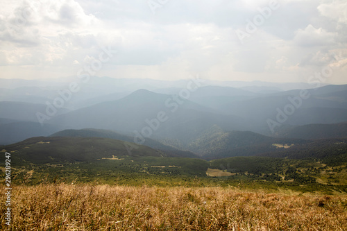 Beautiful landscape of mountains and forests against the blue sky. Travel concept.