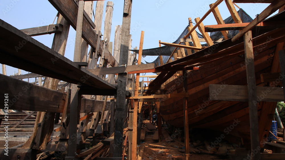 Timber shipbuilder working while working at a shipyard, Batang Indonesia, 14 October 2019 Timber shipbuilder working while working at a shipyard, Batang Indonesia, 14 October 2019