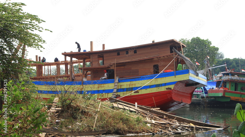 Timber shipbuilder working while working at a shipyard, Batang Indonesia, 14 October 2019