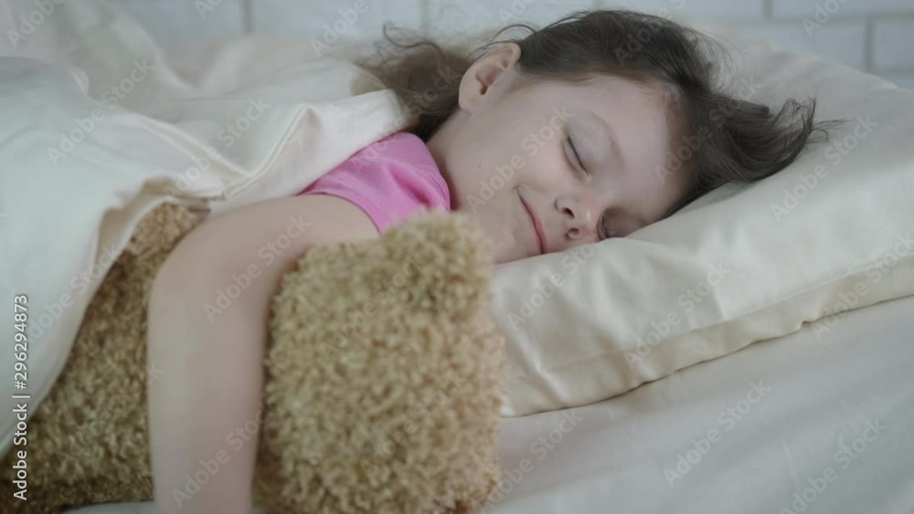 With plush toy in the bed. With plush toy in the bed.