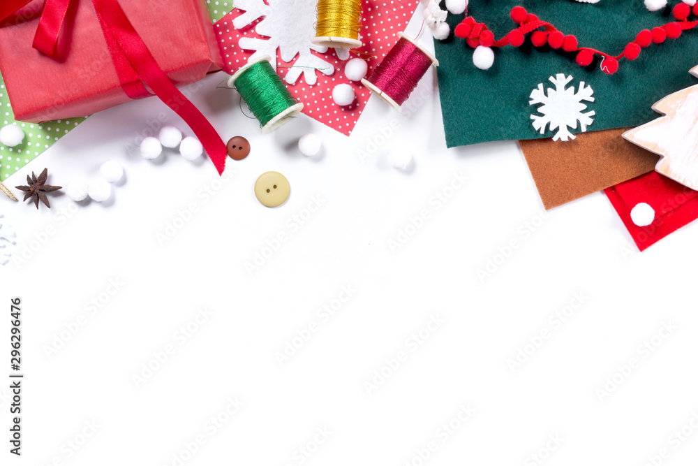 Fototapeta premium Merry Christmas and New Year holidays banner. Gift wrapping workspace. Decoration presents making flat lay top view Xmas celebration preparation DIY concept decor on white background.