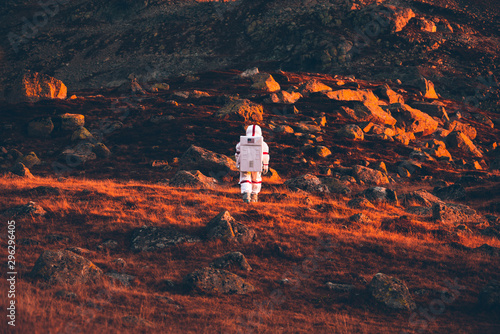 Astronaut exploring a new planet. Searching for a new home for humanity. Concept about science and nature