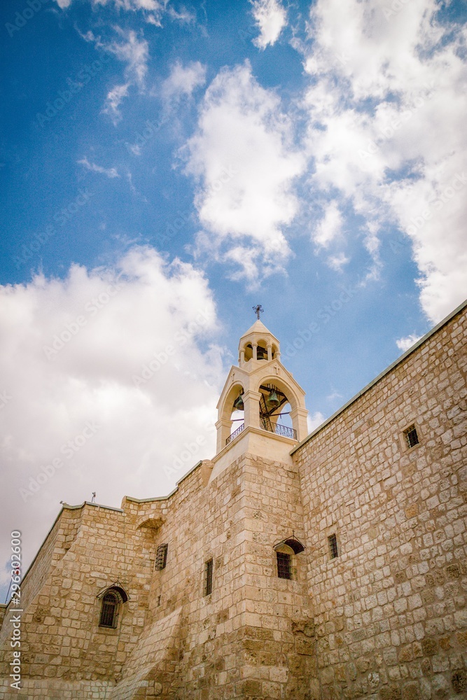 Church of the Nativity. Bell tower and beautiful cloudy sky. Details. Bethlehem, Palestine