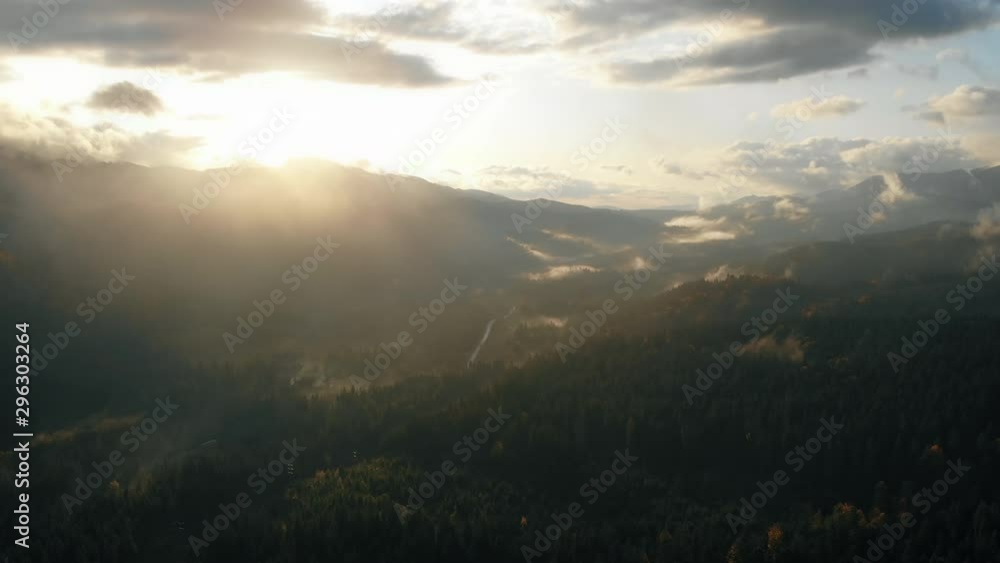 Epic aerial flight. Autumn sunrise in the mountains. Golden autumn. Orange colors. Spiritual inspiration. Vacation concept Epic aerial flight. Autumn sunrise in the mountains. Golden autumn. Orange colors. Spiritual inspiration. Vacation concept