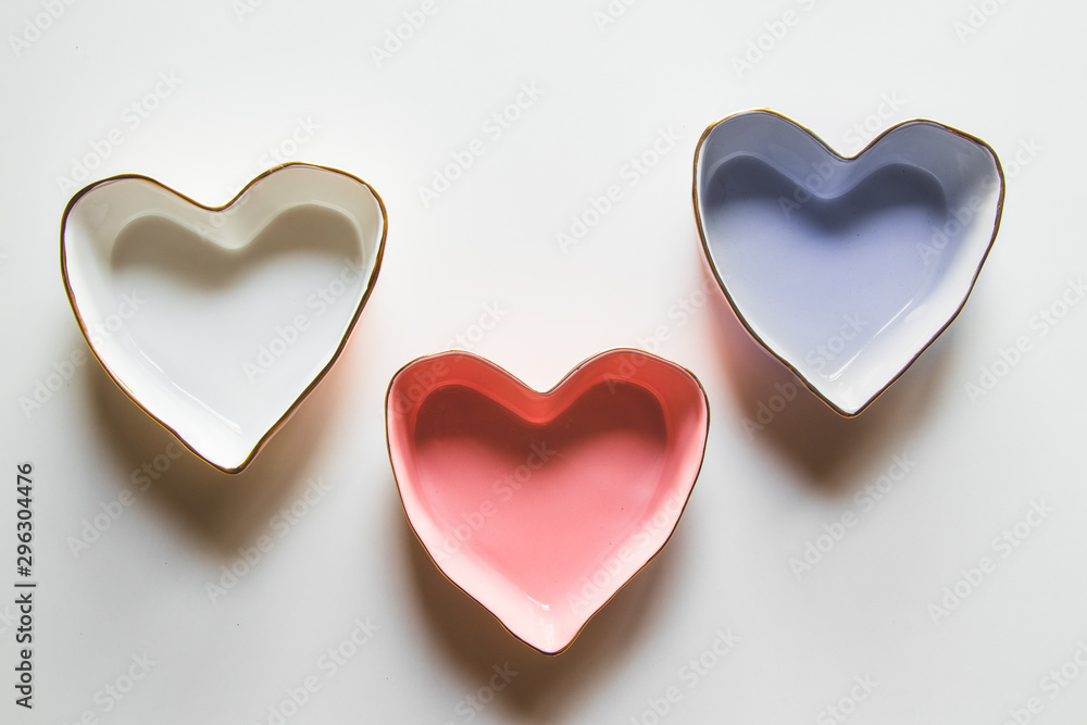 Three plates of hearts on a white background in blue, red and white. Three plates of hearts on a white background in blue, red and white.