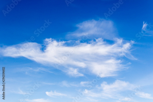 Fototapeta Naklejka Na Ścianę i Meble -  white fluffy clouds on a background of blue sky on a clear summer day