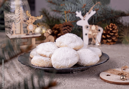 Traditional Christmas cookies biscuits snowballs covered icing sugar povder with almond nut, nutella chocolate an raspberry jam. Christmas New Year ornament decorations. photo