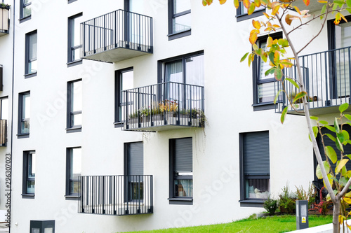 Fototapeta Exterior of a modern  apartment buildings with balcony and white walls